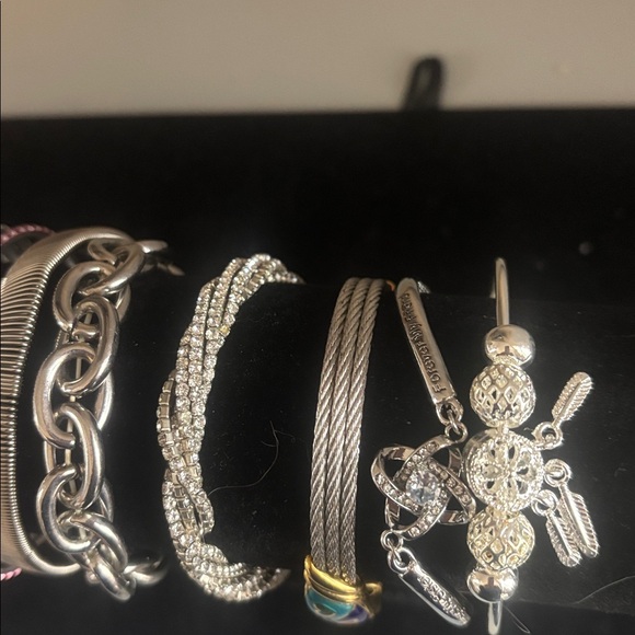 Lot of silvertone bracelets.2 are stretchy and some have adjustable chains. - Picture 3 of 5